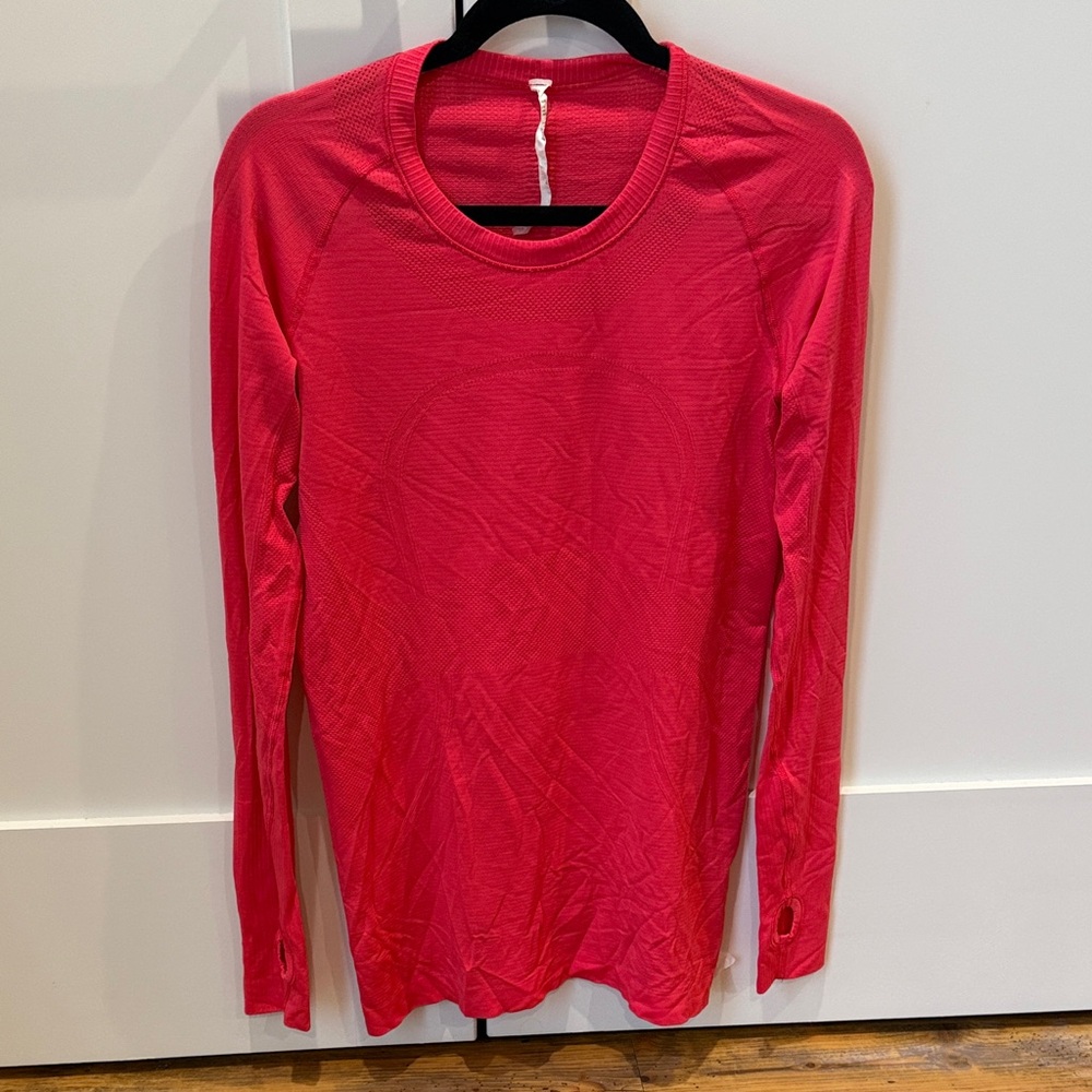 Lululemon long sleeve size 10. More of a pink than red color